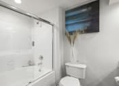 Thumbnail 23 of 25 - Luxury apartments with oval soaking tub with glass enclosure and glass shower at Tuscany Park Apartments in Houston.