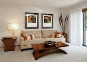 Thumbnail 28 of 35 - Spacious living room with large balcony at LionsHead Apartments in Omaha, Nebraska