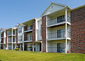 Thumbnail 22 of 30 - Apartments with red brick exteriors and large balconies at The Vanderbilt Apartments in Omaha, Nebraska