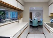 Thumbnail 2 of 30 - Kitchen with lots of cabinet space, lots of counter space, and spacious dining room, at The Vanderbilt Apartments in Omaha, Nebraska
