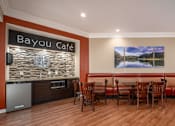 Thumbnail 27 of 42 - Huge clubhouse with coffee bar, spacious resident lounge, free wi-fi, and fitness center at Woodlake on the Bayou Apartments in Houston.