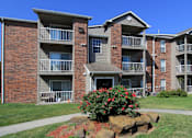 Thumbnail 42 of 44 - Apartments in central Lincoln Nebraska with beautiful landscaping, scenic views, large balconies, spacious balconies, huge swimming pool, and pool-side lounge chairs at Tanglewood Apartments