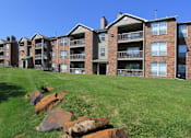 Thumbnail 2 of 44 - Apartments on 44th and O Street in Lincoln Nebraska with beautiful landscaping, lush landscaping, scenic views, large balconies, spacious balconies, at Tanglewood Apartments
