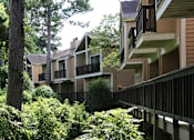 Thumbnail 10 of 38 - Gated apartments with convenient bayou location, lush landscaping, and scenic views at Woodlake Oaks Apartments in Houston