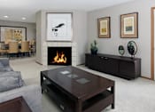 Thumbnail 10 of 30 - Spacious floor plan, open floor plan, spacious apartment with woodburning fireplace, spacious dining room, and gray wall color at The Vanderbilt Apartments in Omaha, Nebraska