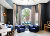 Thumbnail 27 of 36 - Luxury resident lounge space with free wi-fi at Tuscany Apartments in Houston.