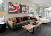 Thumbnail 14 of 31 - Luxury apartments with wood plank floors, spacious floor plan, oversized windows and gray wall color at Rockledge Oaks Apartments in Lincoln, Nebraska