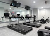 Thumbnail 2 of 36 - Newly remodeled Fitness Center open 24/7 with brand new Life Fitness equipment including 1 peloton bike, 4 resistance machines, 2 treadmills, 1 life cycle, 1 elliptical, full rack of free weights and dumbbells and water bottle refill fountain.