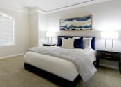 Thumbnail 15 of 34 - Huge bedroom, spacious bedroom with vaulted ceiling, ceiling fan, walk-in closet, and attached bathroom at Tuscany Row Townhomes in Houston.
