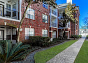 Thumbnail 33 of 36 - Luxury apartments with brick exteriors, beautiful landscaping, and patios with extra storage and French doors at Tuscany Apartments in Houston.