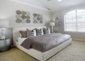 Thumbnail 18 of 34 - Huge master bedroom, spacious master bedroom with ceiling fan, high vaulted ceiling, over-sized windows, walk-in closet and attached luxury bath suite at Tuscany Villas in Houston.