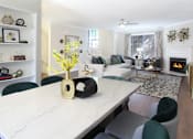 Thumbnail 7 of 34 - Spacious dining room with built-in bookshelves, hardwood floors, spacious living room with wood-burning fireplace at Tuscany Row Apartments in Houston.