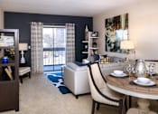 Thumbnail 27 of 41 - Spacious living room with colored feature wall at Embassy Park Apartments in Omaha, Nebraska