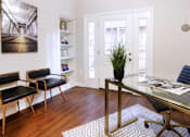 Thumbnail 4 of 26 - Huge office space, spacious den with built-in shelves, hardwood floors, and private backyard patio at Tuscany Villas Townhomes in Houston.