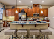 Thumbnail 32 of 36 - Luxury apartments next to the Galleria in Dallas with spacious floor plan, granite countertops, stainless steel appliances, built-in wine rack, kitchen island, front-loading washer and dryer and porcelain tile floor at Villa Piana Apartments in Dallas