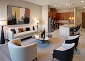 Thumbnail 24 of 25 - Spacious dining room with large bay windows and wood plank floors at Tuscany Park Apartments in Houston.