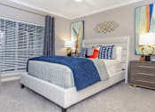 Thumbnail 2 of 22 - Spacious bedroom with gray colored walls, large windows and walk-in closet, at The Dorchester Apartments in Dallas Texas