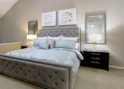 Thumbnail 5 of 42 - Huge master bedroom with vaulted ceiling and loft style layout with attached master bathroom and walk-in closet at Woodlake on the Bayou Apartments in Houston.