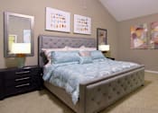 Thumbnail 25 of 42 - Huge master bedroom with vaulted ceiling and loft style layout with attached master bathroom and walk-in closet at Woodlake on the Bayou Apartments in Houston.