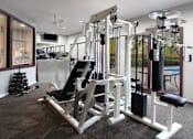 Thumbnail 12 of 20 - Fitness center and outdoor swimming pool at Inwood Apartments in La Vista, Nebraska