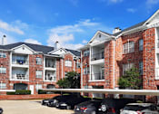 Thumbnail 32 of 73 - Gated luxury apartment community in north Dallas with red brick exteriors at The Saxony Apartments