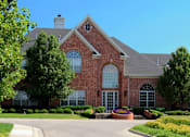 Thumbnail 26 of 36 - Luxury apartments with red brick exterior, lush landscaping, park-like setting, and scenic views at Lenox Village Apartments in Lincoln, Nebraska