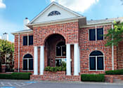 Thumbnail 31 of 73 - Gated apartment community near the Galleria in Dallas with luxury clubhouse and resident lounge, free wi-fi, meeting room, red brick exteriors, and beautiful landscaping at The Saxony Apartments