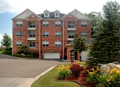 Thumbnail 15 of 26 - Luxury apartments with red brick exterior, garages, and scenic views in Minnetonka, Minnesota