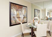 Thumbnail 6 of 31 - Luxury apartments with spacious dining room and mirror accent wall at Rockledge Oaks Apartments in Lincoln, Nebraska