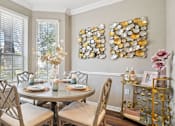 Thumbnail 16 of 73 - Spacious dining room with wood plank floors and oversized windows, luxury apartments in Dallas