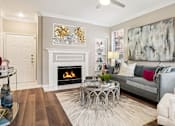 Thumbnail 14 of 73 - Luxury apartments with wood-burning fireplace, built-in bookshelves, and oversized windows at The Saxony Apartments