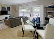 Thumbnail 13 of 35 - Apartments in southwest Omaha with spacious layout, open floor plan, oversized windows, and gray wall color at Breckenridge Apartments