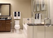 Thumbnail 42 of 42 - Luxury apartments with spacious bathrooms with oval soaking tub, separate shower with glass enclosure, and granite slab vanity top Tuscany Walk Apartments in Houston.