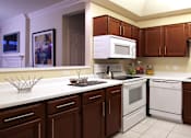 Thumbnail 18 of 42 - Spacious kitchen with lots of cabinet space, side-by-side refrigerator, porcelain tile floors, and lots of counter space at The Biltmore Apartments in Omaha, Nebraska