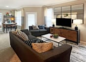 Thumbnail 4 of 35 - Spacious living room and dining room with huge windows and lots of natural light at Breckenridge Apartments in Omaha, Nebraska
