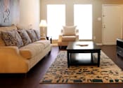 Thumbnail 19 of 21 - Spacious living room, spacious townhome with hardwood floors, and private entries at Briarwood Apartments in Houston.