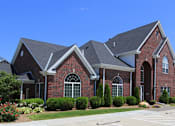 Thumbnail 17 of 31 - Luxury apartments with red brick exteriors, beautiful landscaping, and scenic views at Rockledge Oaks Apartments in Lincoln, Nebraska