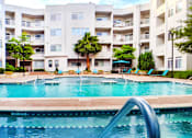 Thumbnail 28 of 29 - Luxury apartments in the Las Colinas area of Irving Texas with a huge resort-style pool, huge sundeck, poolside lounge chairs, and sunken spa