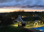 Thumbnail 37 of 41 - Resort-style saltwater pool with huge sun deck, poolside lounge chairs, and park-like setting with lots of trees and scenic views at Embassy Park Apartments in Omaha, Nebraska