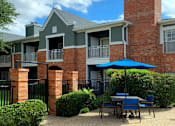 Thumbnail 19 of 36 - Luxury apartments in north Dallas near the Mary Kay Museum with beautiful landscaping, attached garages, and golf course views.