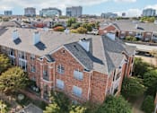 Thumbnail 44 of 73 - Gated luxury apartment community in north Dallas with red brick exteriors at The Saxony Apartments