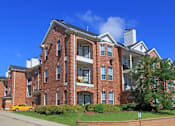 Thumbnail 11 of 38 - Luxury apartments with red brick exteriors, spacious balconies, lush landscaping, and scenic views at TurtleCreek apartments in West Des Moines, Iowa