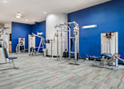 Thumbnail 27 of 73 - Luxury apartments in north Dallas with fitness center and weight lifting machines at The Saxony Apartments
