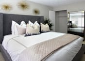 Thumbnail 13 of 20 - Spacious bedroom with walk-in closet and gray wall color at Inwood Apartments in La Vista, Nebraska