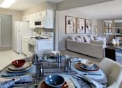 Thumbnail 1 of 20 - Spacious apartments with lots of natural light, spacious living room, spacious dining room, huge apartment, spacious floor plan, bright white kitchen, white kitchen cabinets, and gray wall color at Inwood Apartments in La Vista, Nebraska