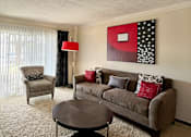 Thumbnail 9 of 27 - Spacious living room with sliding glass doors, extra-large windows with lots of natural light at Kensington Woods Apartments