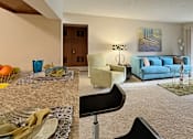 Thumbnail 17 of 35 - Spacious living room with granite breakfast bar at LionsHead Apartments in Omaha Nebraska