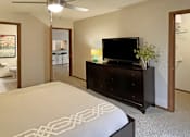 Thumbnail 12 of 35 - Spacious bedroom with walk-in closet and attached bathroom at LionsHead Apartments in Omaha Nebraska