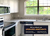 Thumbnail 38 of 38 - Luxury apartments with granite countertops, white cabinets, stainless steel appliances, and side-by-side refrigerator at TurtleCreek apartments in West Des Moines, Iowa