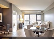 Thumbnail 4 of 41 - a open dining room with table and lamp.